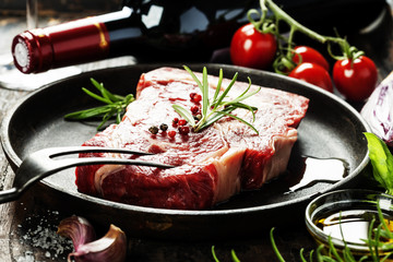 Raw beef steak and wine