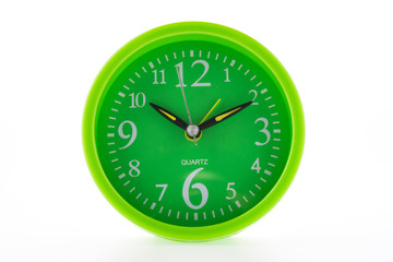 Green clock isolated on white background