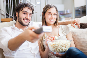 Couple using a remote control