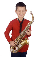 Fototapeta premium Young boy playing the sax