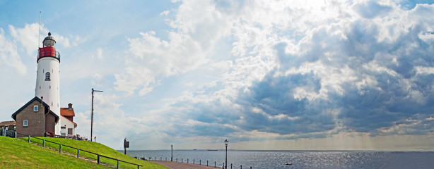 Lighthouse on former island Urk, The Netherlands - obrazy, fototapety, plakaty