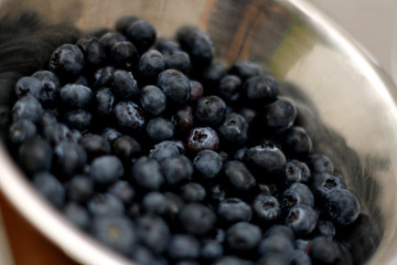 Blueberries in a metal bowl, shallow depth of field