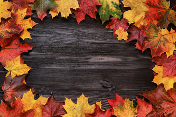 Frame with autumn leaves on a wooden background - 71893014