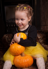 Fototapeta premium beautiful little girl with pumpkin