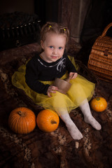 Fototapeta premium beautiful little girl with pumpkin