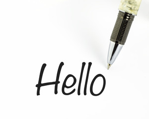 Pen writes hello word on paper. © abdrahimmahfar