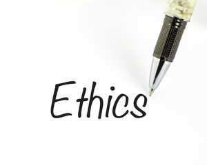 Pen writes ethics word on paper - 71897680