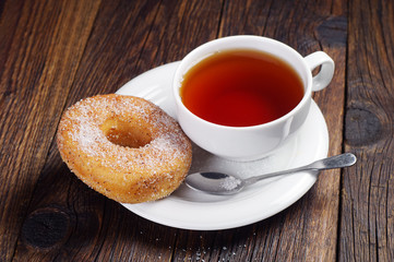 Sweet donut and tea cup