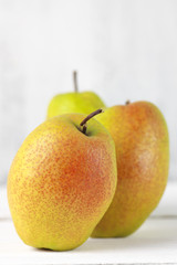 Pears on white wood