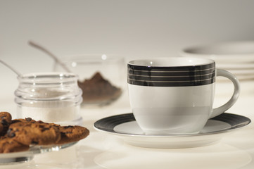 coffee cup, chocolate cookies and sugar,