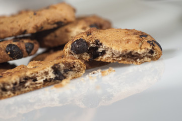 chocolate cookies with sugar, coffee and cup background