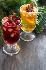 spicy Christmas beverages on a wooden background, vertical