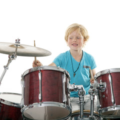 young boy playing drums