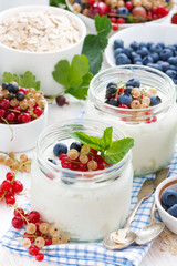 yogurt with berries and products for healthy breakfast, top view