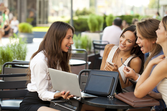 Interracial business team working at laptop in a office outdoor