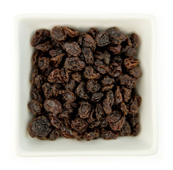 Raisins in white bowl