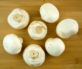 Common mushrooms on cutting board