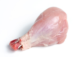 Fresh skinless chicken drumstick leg against white