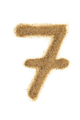 Number 7 made of sand isolated on white