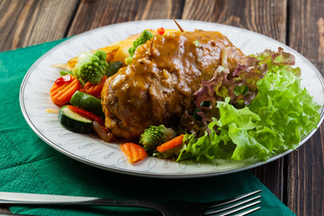Pork rolls with prepared potatoes and vegetables