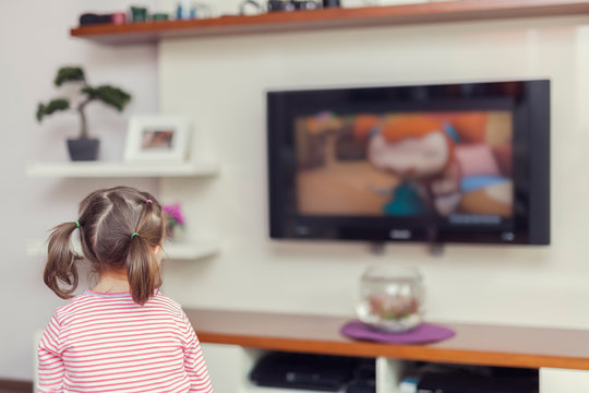 little cute girl watching tv