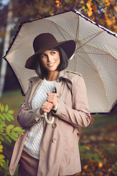 Elegant beautiful model with umbrella