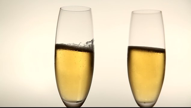 Two glasses with champagne toasting