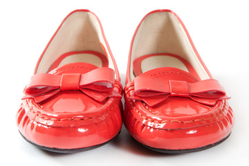 Red female shoes on white background