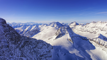 Peaks chain skyline and valley in Jungfrau region helicopter vie