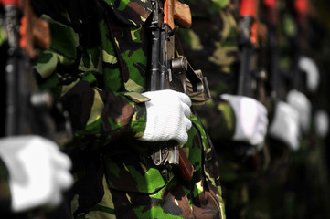 Soldier hand on AKM rifle