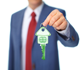 Hand with a house key.