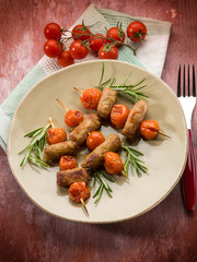 skewer with sausage and cherry tomatoes