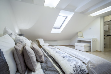 Comfy enormous bed in bright bedroom