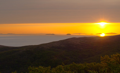 Fototapeta na wymiar Sunrise over sea. Islands