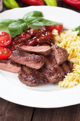 Beef steak with pasta and red beans