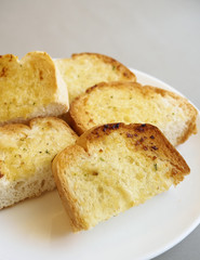 Garlic bread slices on  plate