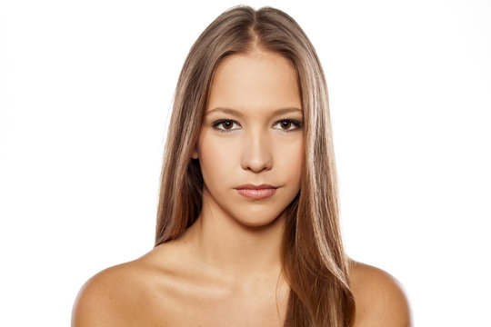 Young woman with beautiful healthy face on white background