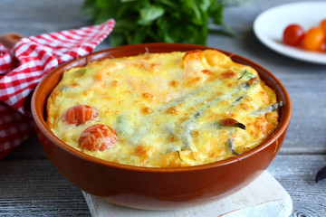 Vegetables baked with cheese in a pan