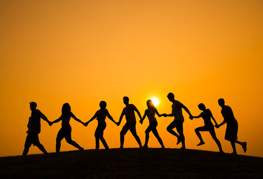 Silhouette of People Walking on the Hill
