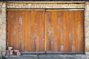 Old wooden garage gate, background photo texture