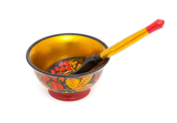Russian Khokhloma bowl and spoon isolated on white