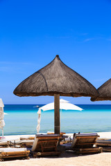 Beach chairs on tropical sand beach