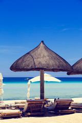 Beach chairs on tropical sand beach