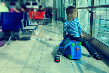 little boy waiting in the airport
