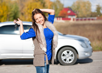 Fototapeta na wymiar girl in a car holding keys