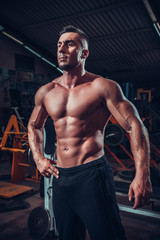 Fototapeta na wymiar muscle man who is posing