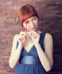 Beautiful girl with a red key
