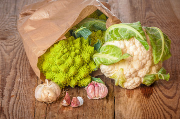 Romanesco broccoli with cauliflower and garlic in a paper bag on