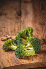 Green delicious broccoli on a wooden rustic table