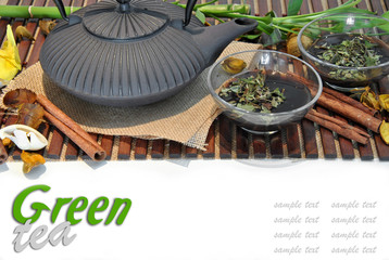 METAL TEAPOT WITH TWO CUPS OF TEA